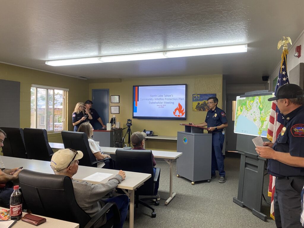 Chief of North Lake Tahoe Fire Protection District, Ryan Sommers discusses the Community Wildfire Protection Plan to community members who joined the public meeting on June 1st 2023. 